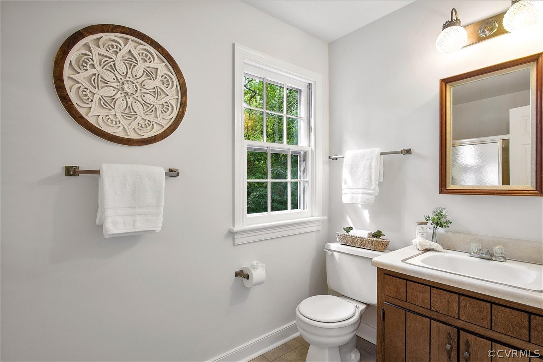 1006 Castle Hollow Road Midlothian, VA 23114 - Photo 37 of 42 a bathroom with a toilet a sink and a mirror