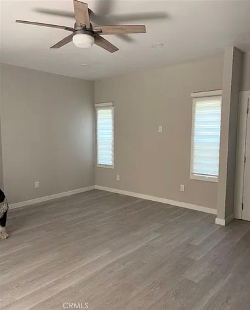 1738 East 4th Street Long Beach, CA 90802 - Photo 3 of 7 an empty room with windows and fan