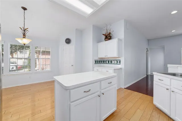 a kitchen that has a lot of cabinets in it