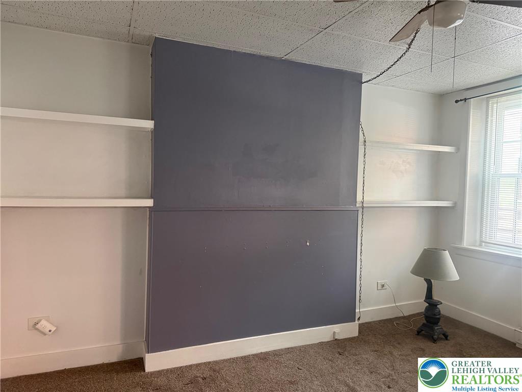 18 South 2nd, Unit B Easton, PA 18042 - Photo 2 of 8 a room with a chair and a window