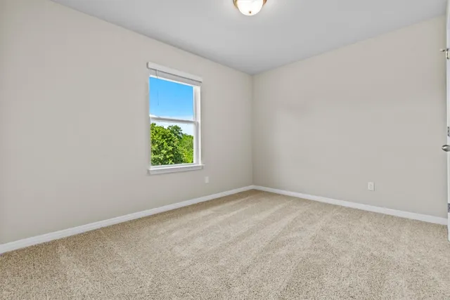 an empty room with window