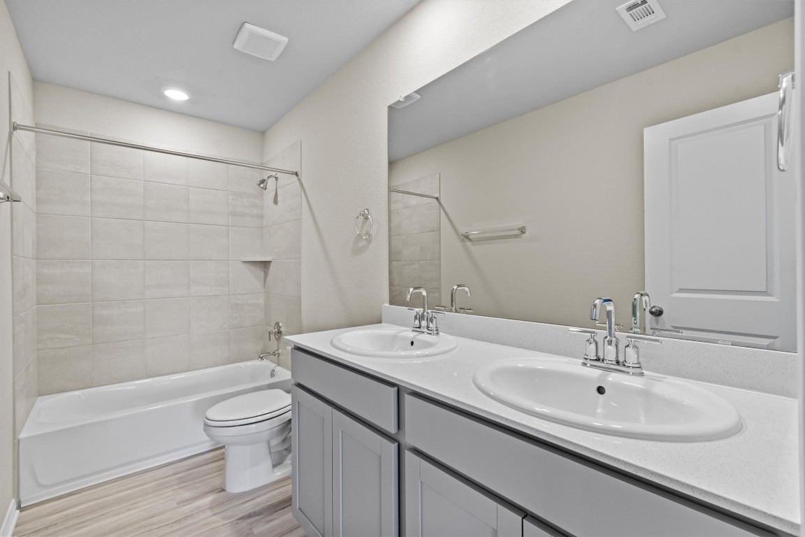 520 View Drive Georgetown, TX 78628 - Photo 18 of 23 a bathroom with a sink toilet and shower