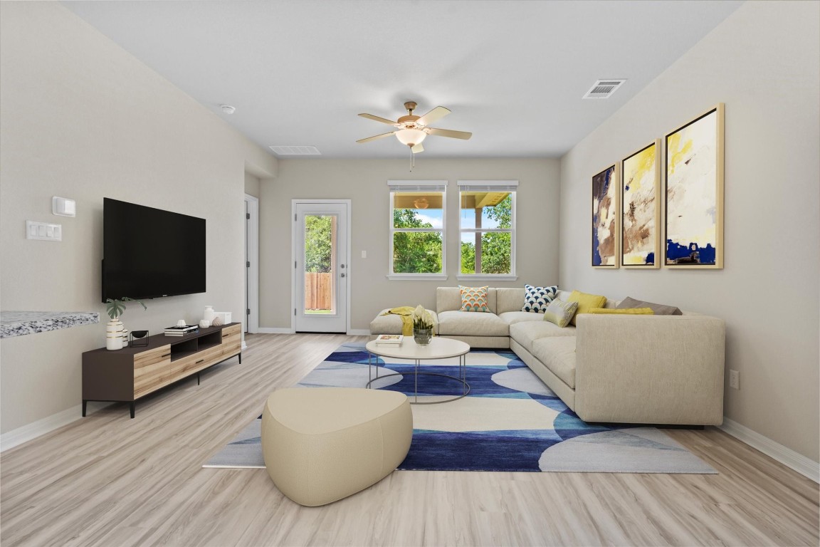 520 View Drive Georgetown, TX 78628 - Photo 4 of 23 a living room with furniture and a flat screen tv