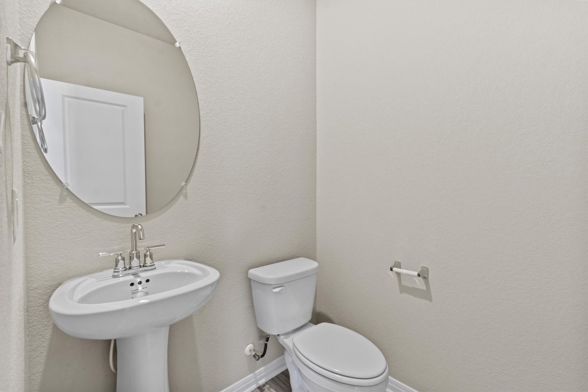 520 View Drive Georgetown, TX 78628 - Photo 8 of 23 a bathroom with a toilet a sink and mirror
