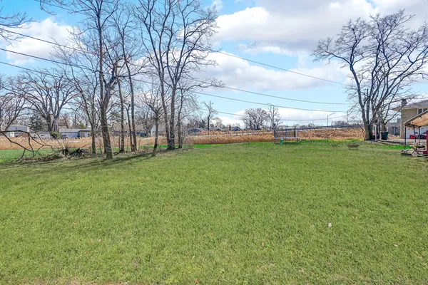 a view of a yard with a house