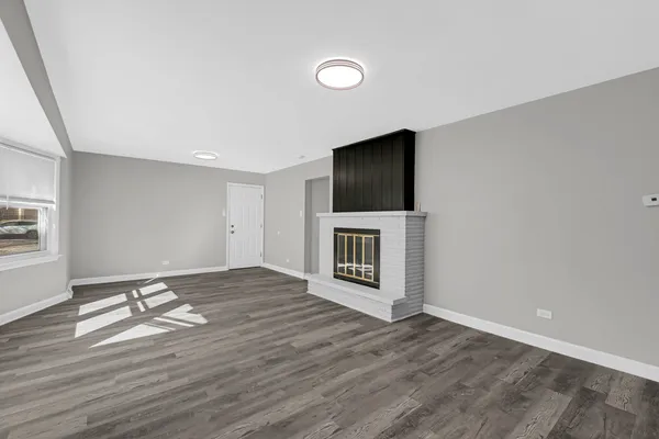 a view of livingroom with hardwood floor and a flat screen tv