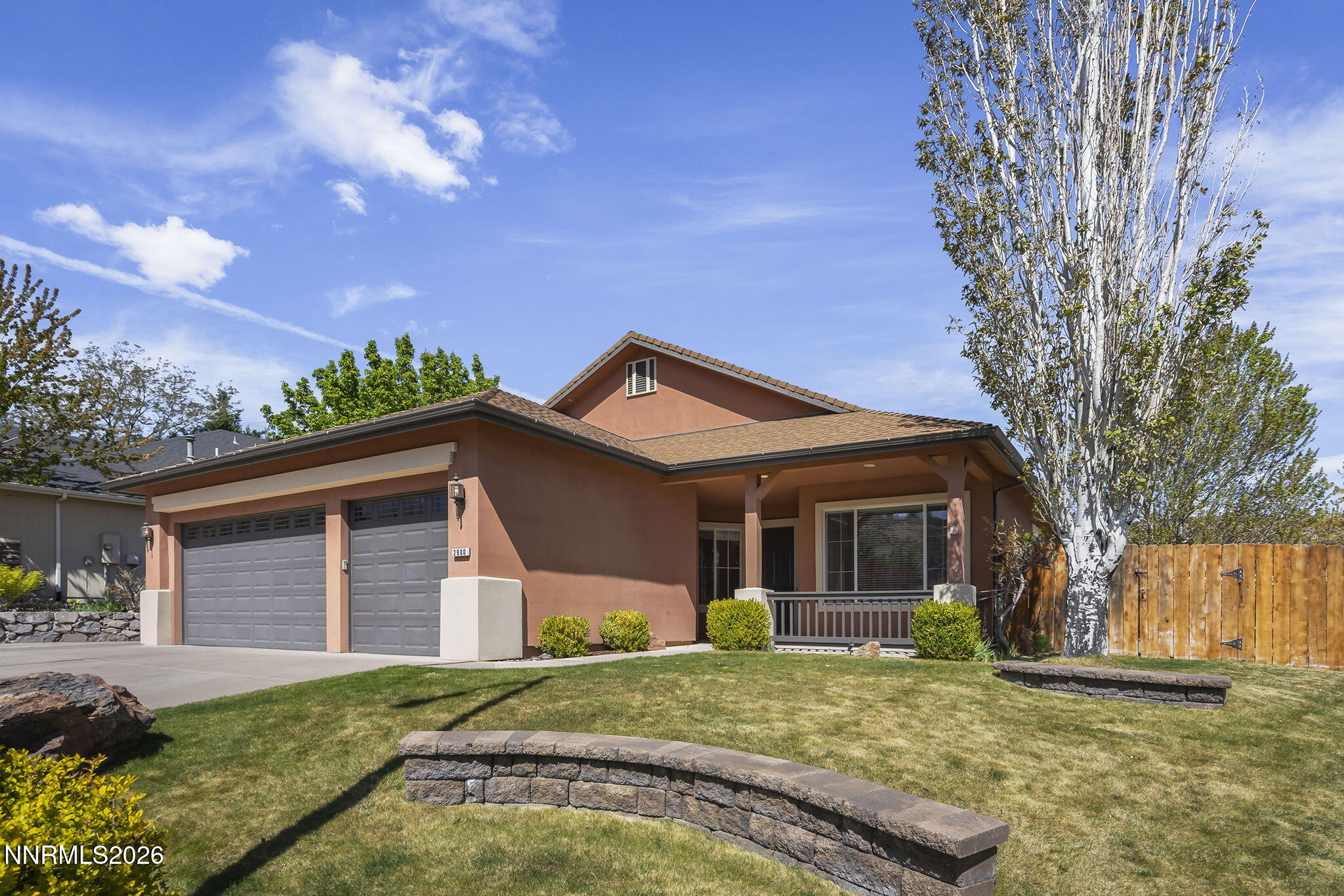 2900 Moose Ridge Drive Reno, NV 89523 - Photo 1 of 43 a front view of a house with a yard and garage