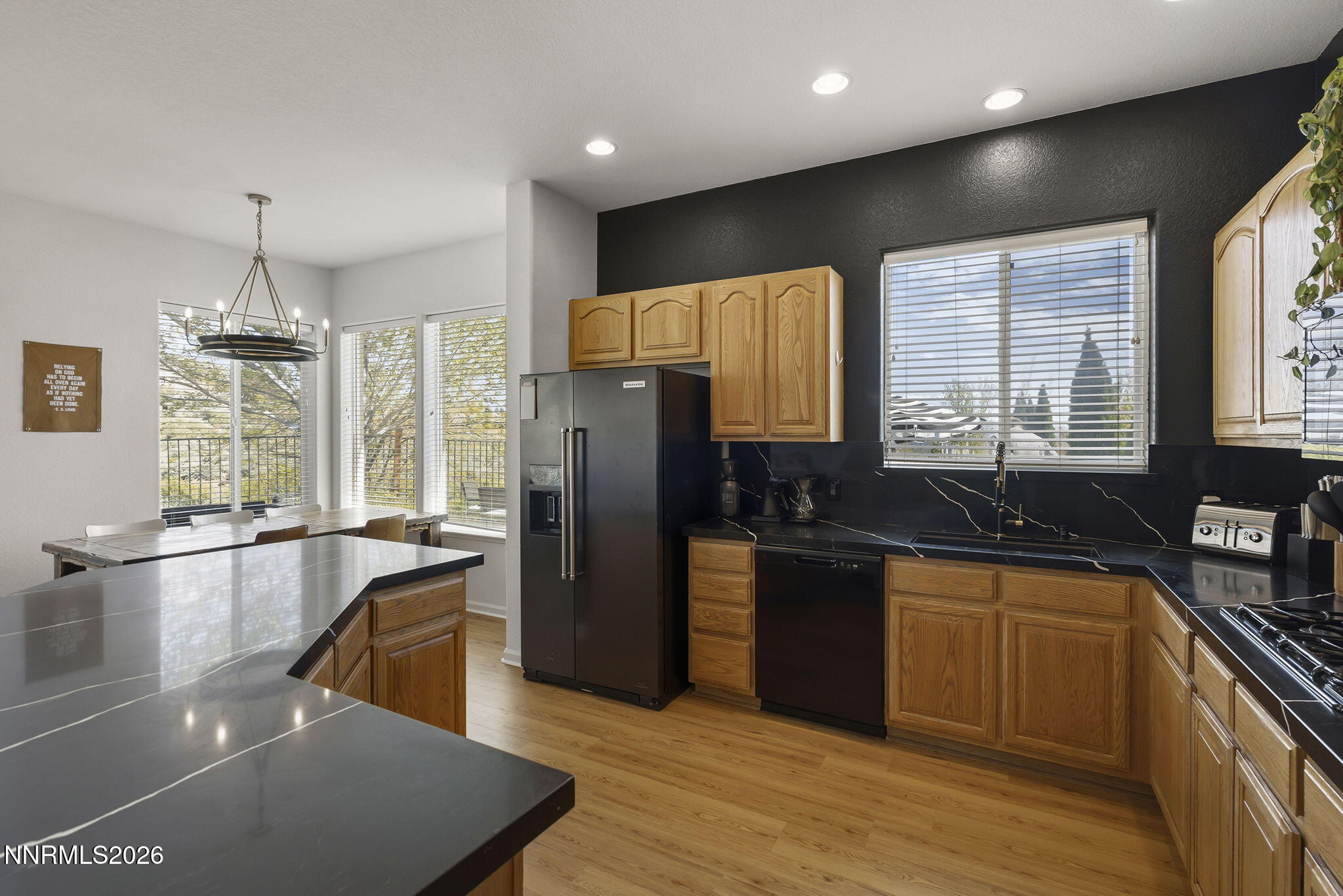 2900 Moose Ridge Drive Reno, NV 89523 - Photo 13 of 43 a kitchen with stainless steel appliances granite countertop a sink a stove and refrigerator