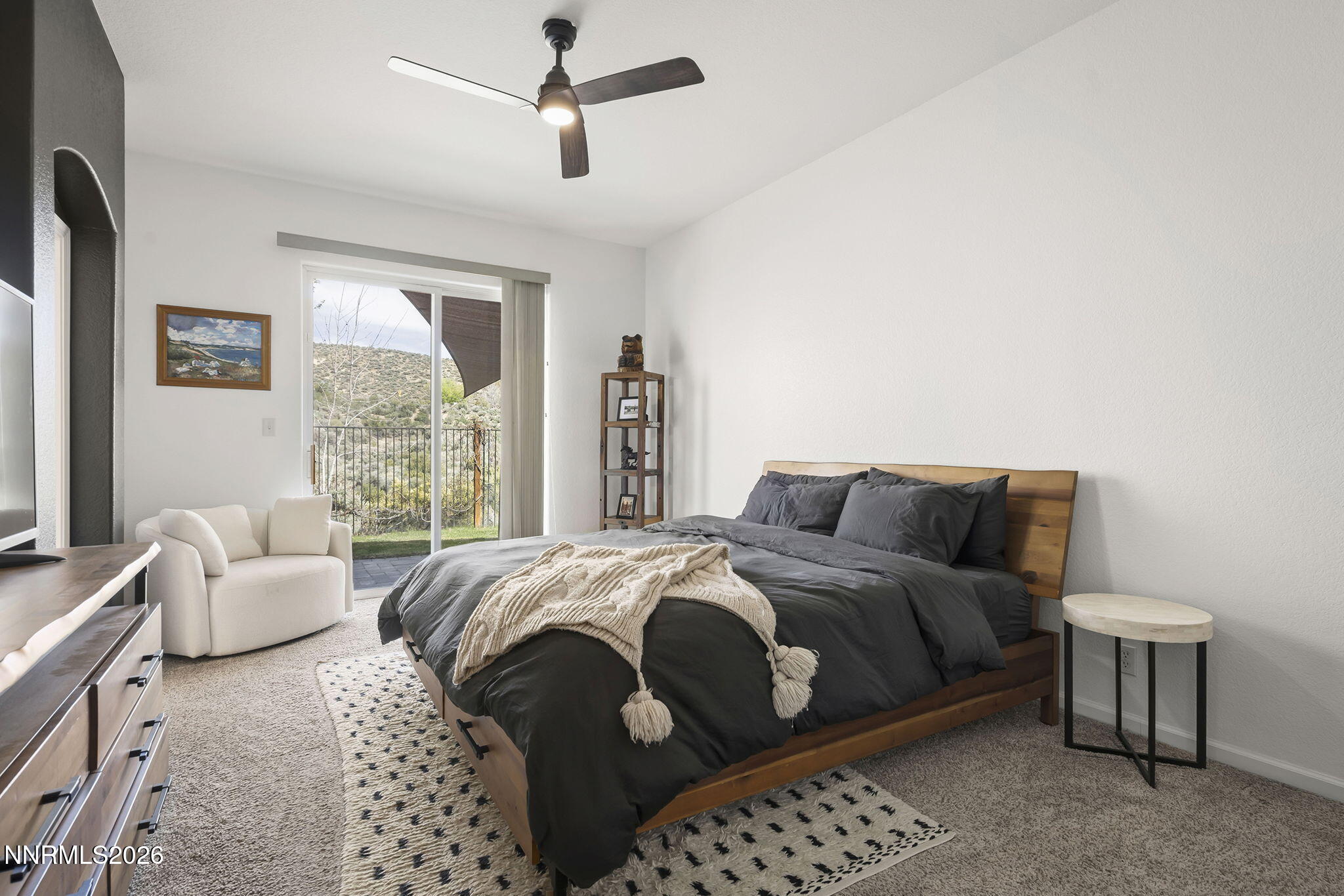 2900 Moose Ridge Drive Reno, NV 89523 - Photo 20 of 43 a bedroom with a bed and a couch