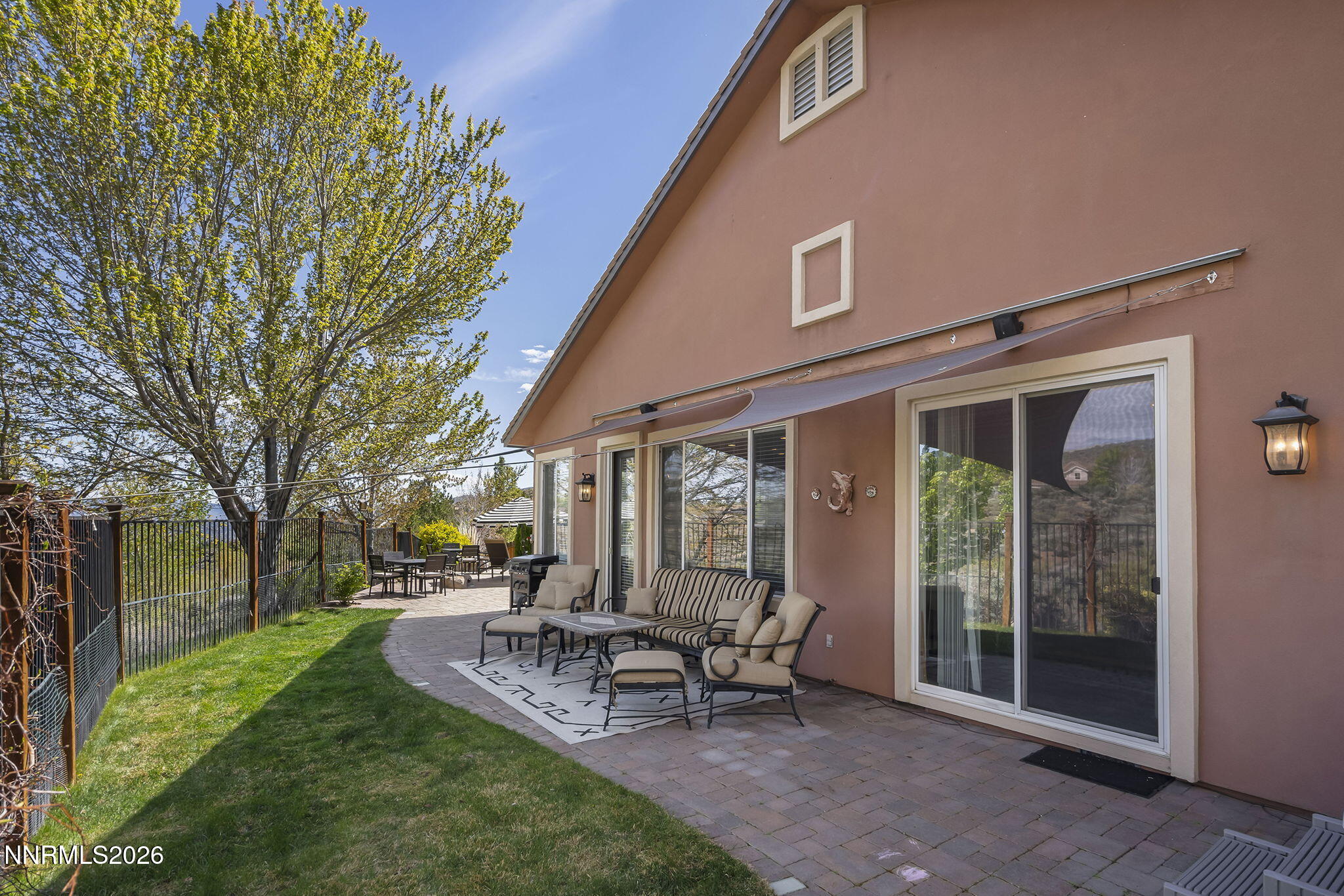 2900 Moose Ridge Drive Reno, NV 89523 - Photo 29 of 43 a view of a patio with table and chairs and a large tree