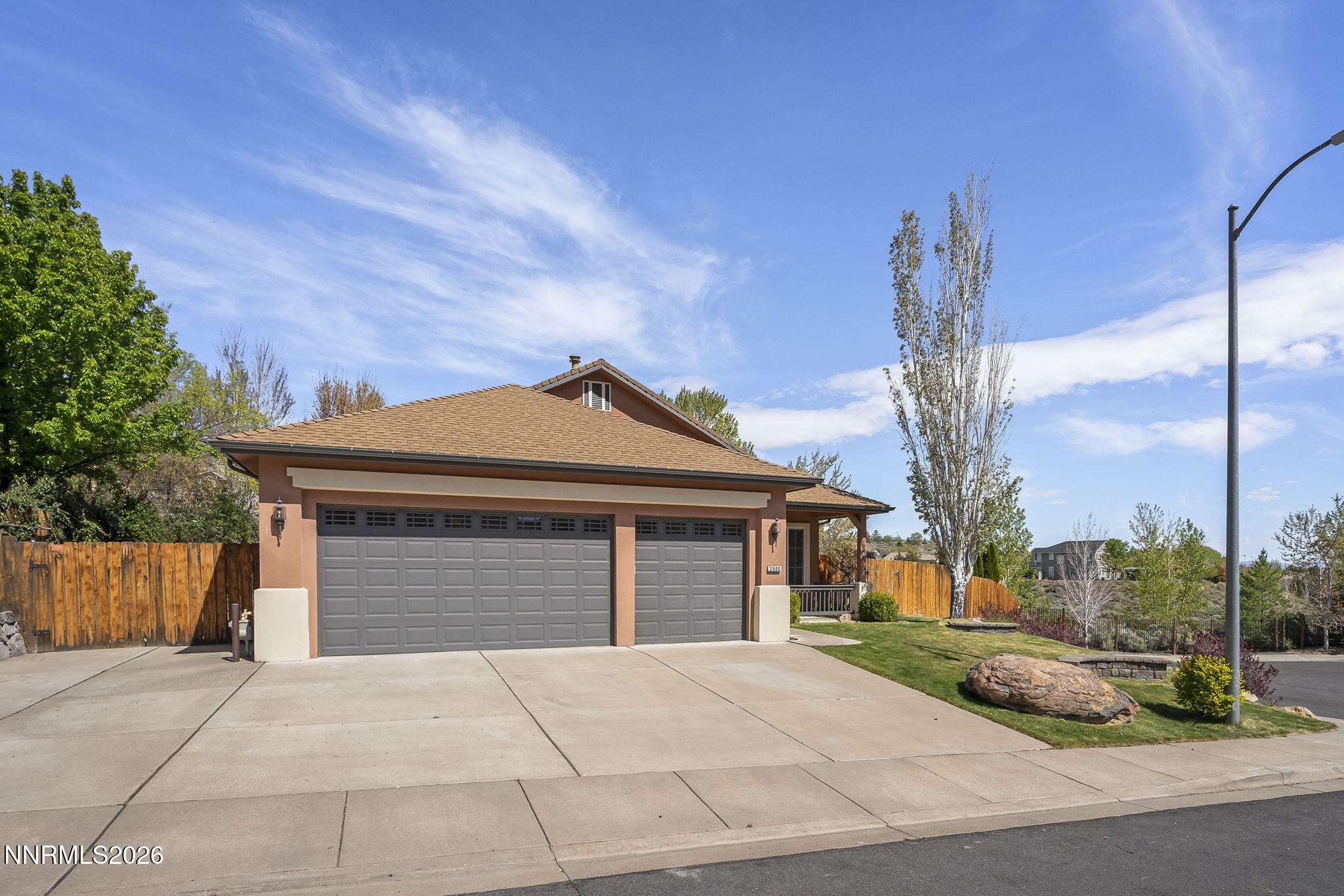 2900 Moose Ridge Drive Reno, NV 89523 - Photo 6 of 43 a front view of a house with a garden and plants