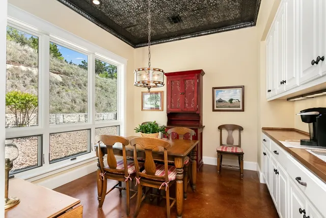 a view of a dining room with furniture window and outside view