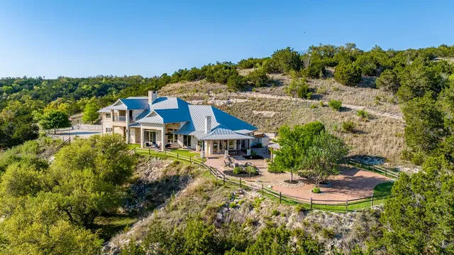 a view of balcony with wooden floor and fence