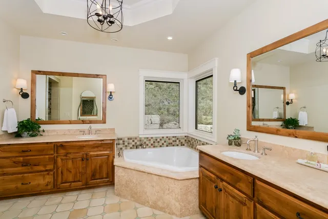 a view of a swimming pool with outdoor seating and plants