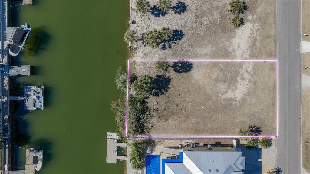 4348 Tahiti Drive Hernando Beach, FL 34607 - Photo 3 of 11 an aerial view of a house with a yard