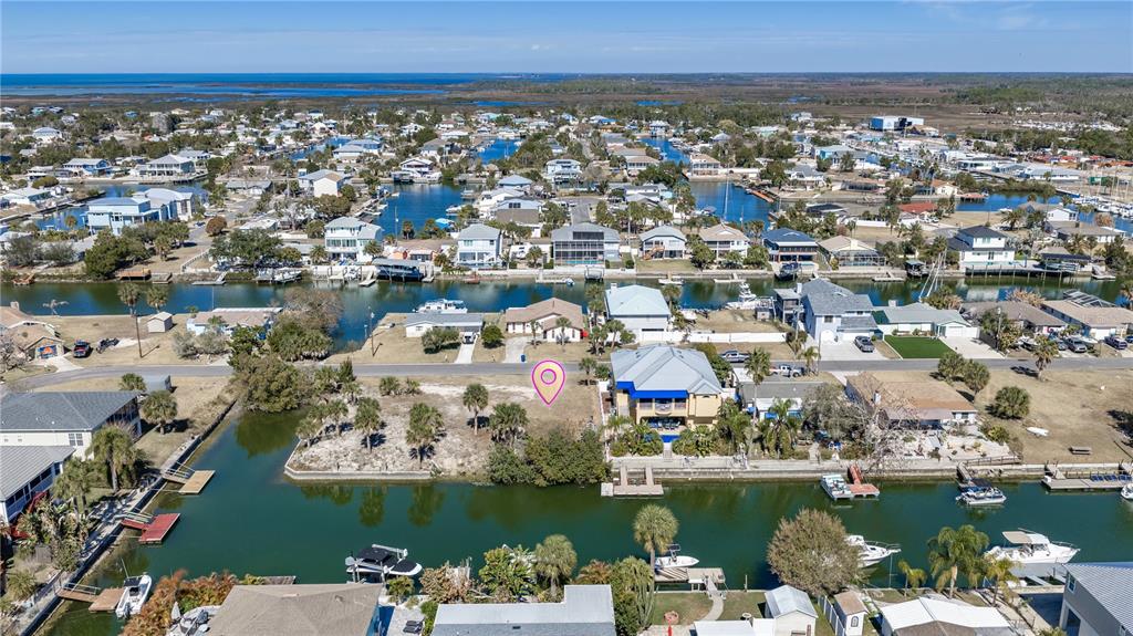 4348 Tahiti Drive Hernando Beach, FL 34607 - Photo 9 of 11 an aerial view of a city with houses