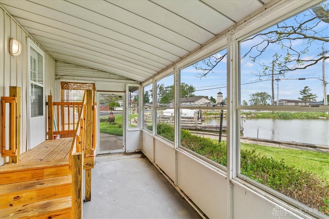 246 North Orchard Island Road Russells Point, OH 43348 - Photo 7 of 43 This enclosed porch provides tranquil water views, ideal for relaxation.