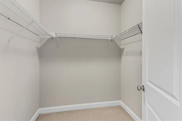a view of an empty walk in closet