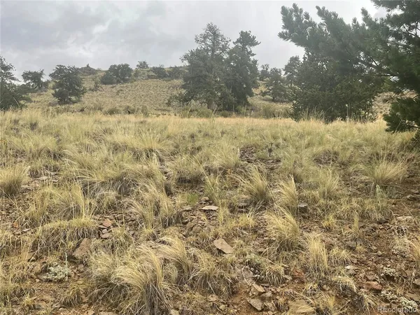 a picture of a room with a white table and a chair