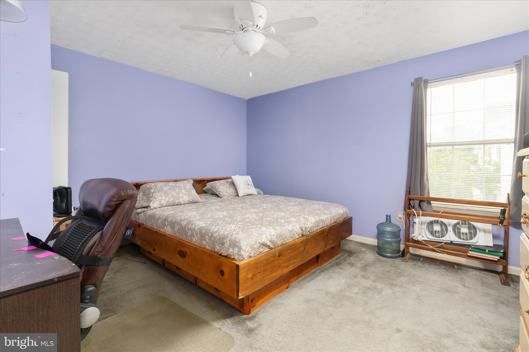 132 Stadium Circle Inwood, WV 25428 - Photo 16 of 25 a bed sitting in a room next to a window