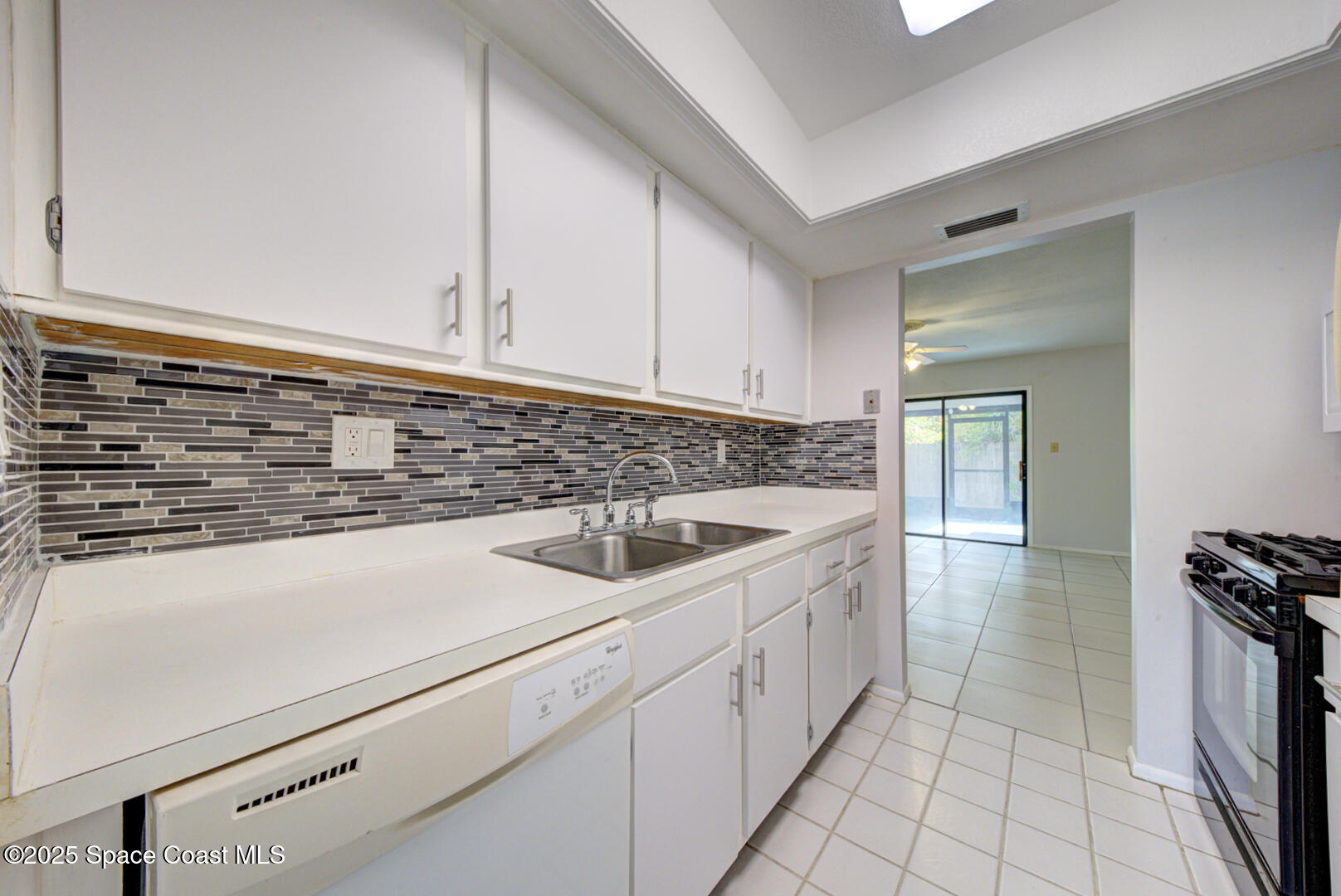 4749 Sisson Road Titusville, FL 32780 - Photo 11 of 30 kitchen with mosiac backsplash