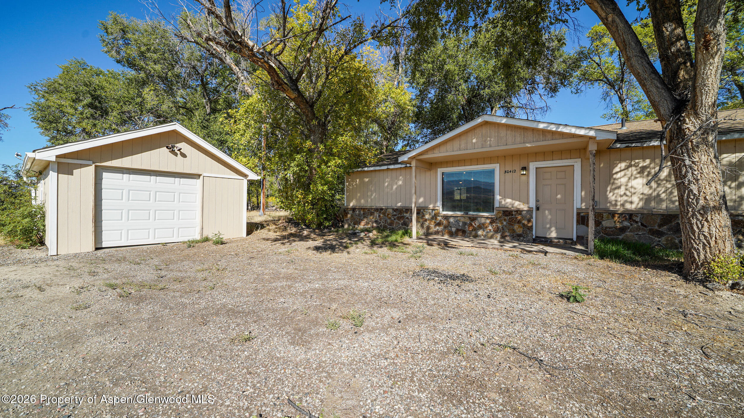 30412 Highway 6 Rifle, CO 81650 - Photo 21 of 24 a front view of a house with a yard