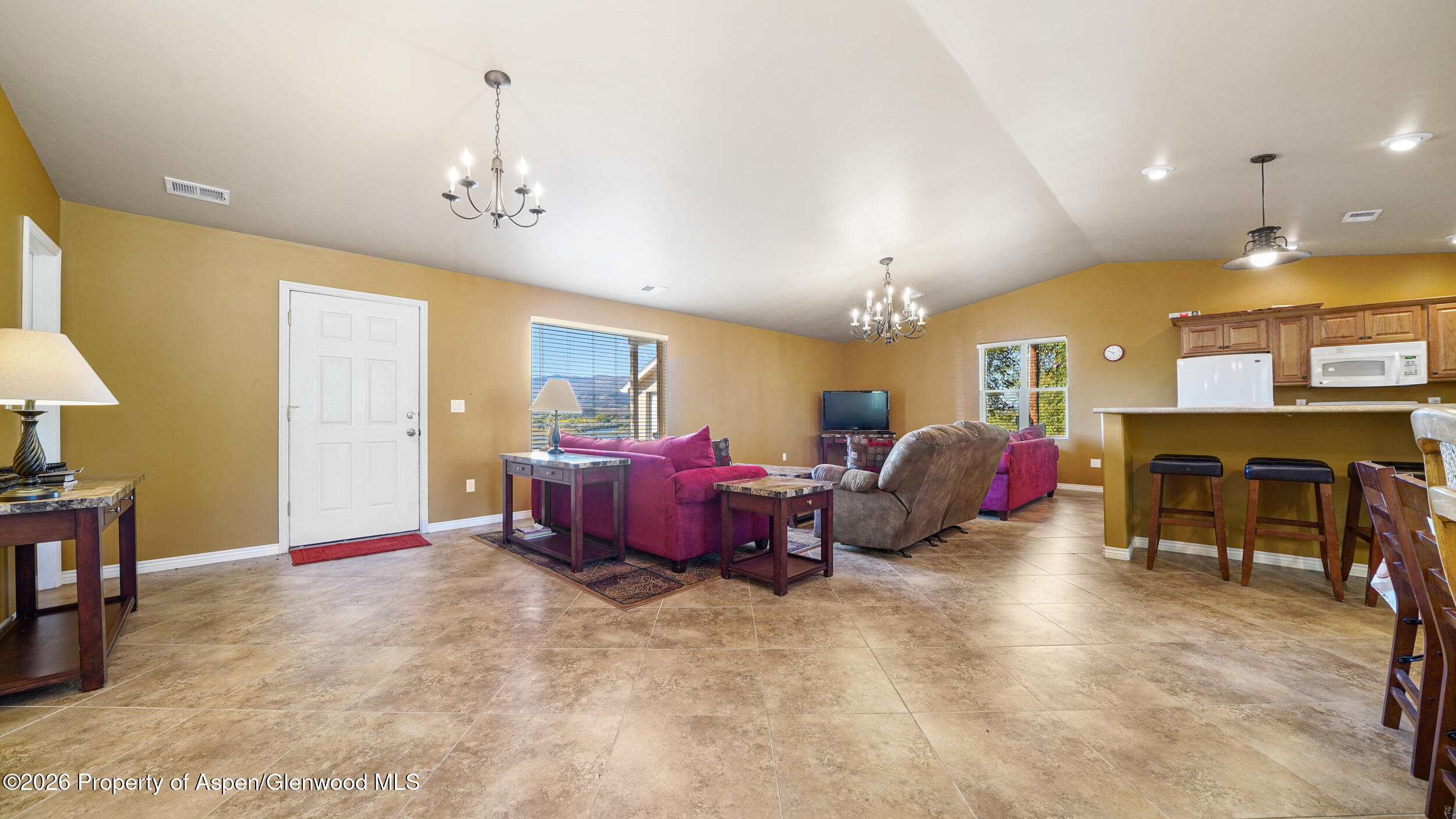 30412 Highway 6 Rifle, CO 81650 - Photo 5 of 24 a spacious bedroom with bed and a chandelier