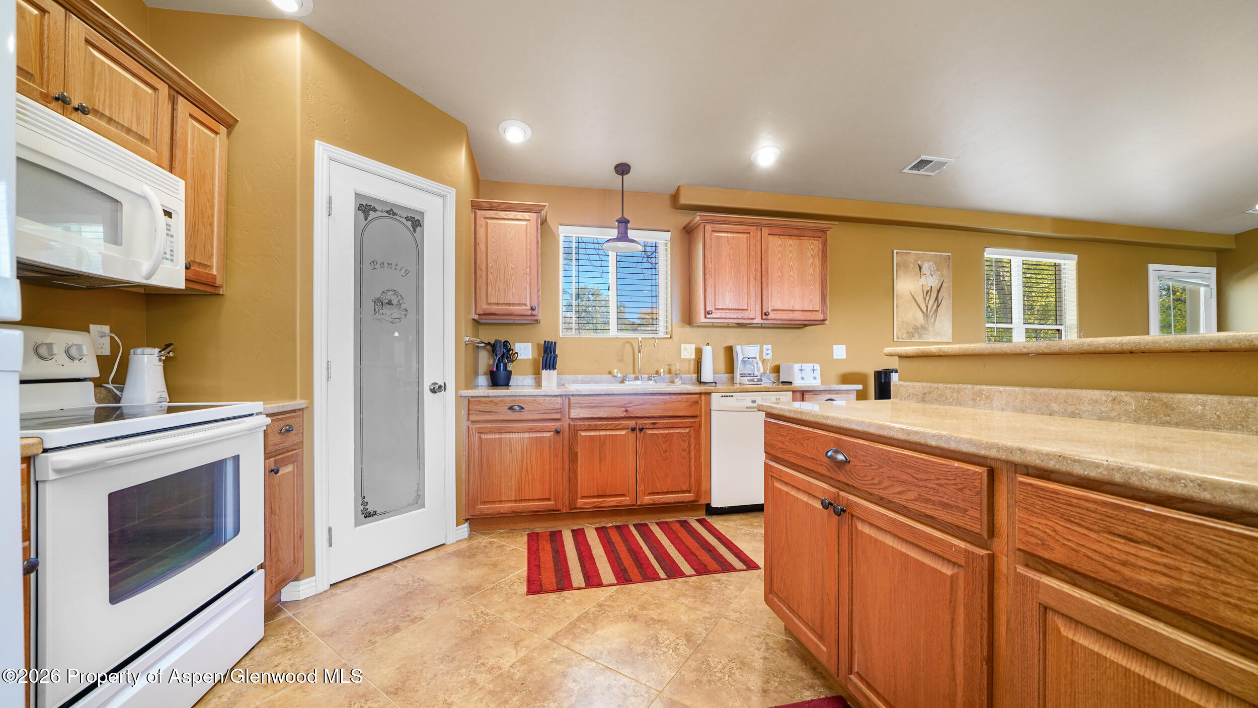 30412 Highway 6 Rifle, CO 81650 - Photo 8 of 24 a kitchen with a sink stove and refrigerator