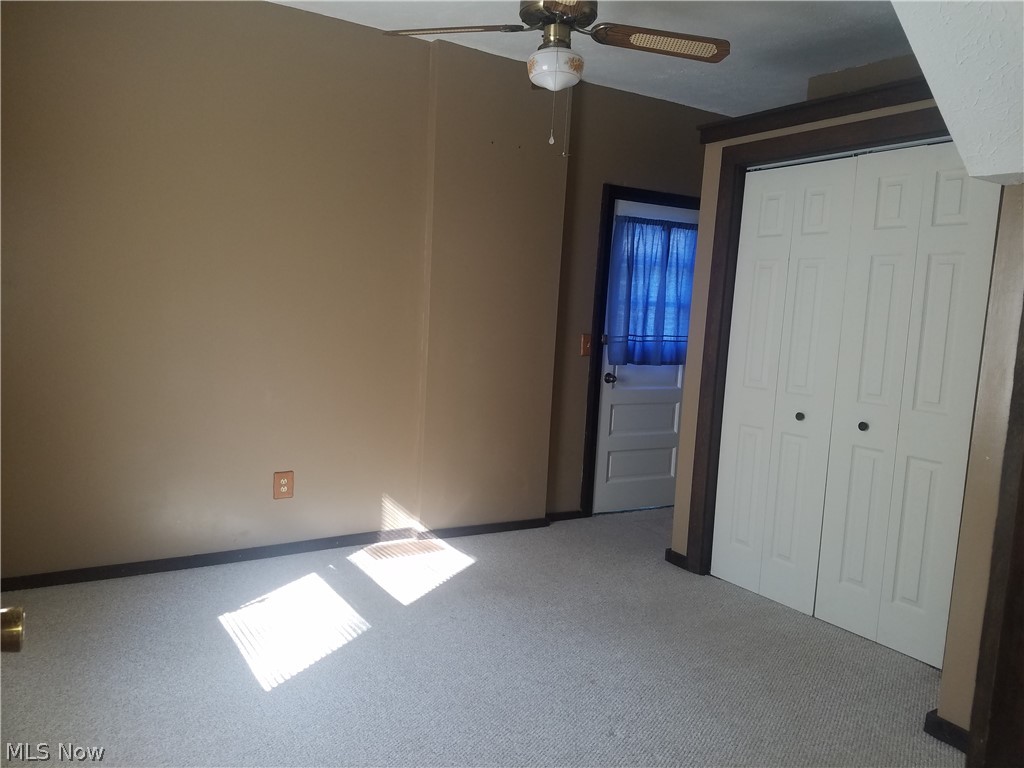 4695 Middle Ridge Road Perry, OH 44081 - Photo 20 of 28 Master bedroom off of living room. Fresh paint, new closet door. Man door leads to outside. Bathroom across from outside man door.
