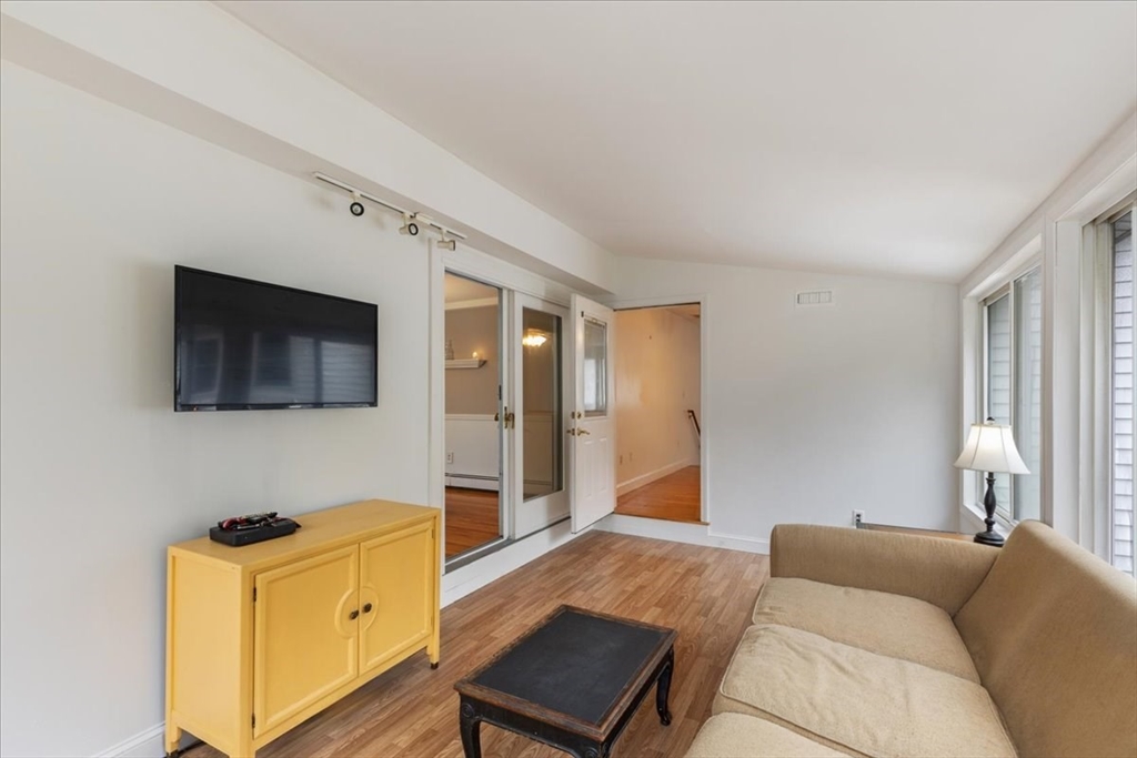 9 Georgia Drive Walpole, MA 02081 - Photo 12 of 42 a living room with furniture and a flat screen tv