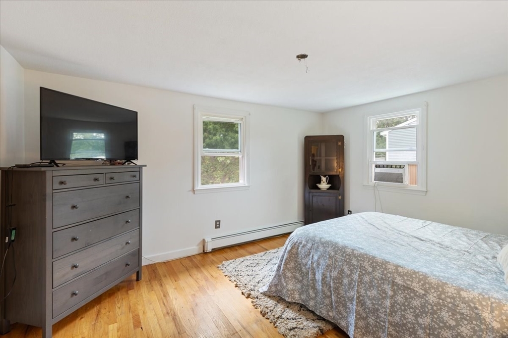 9 Georgia Drive Walpole, MA 02081 - Photo 16 of 42 a bedroom with a large bed and a flat screen tv