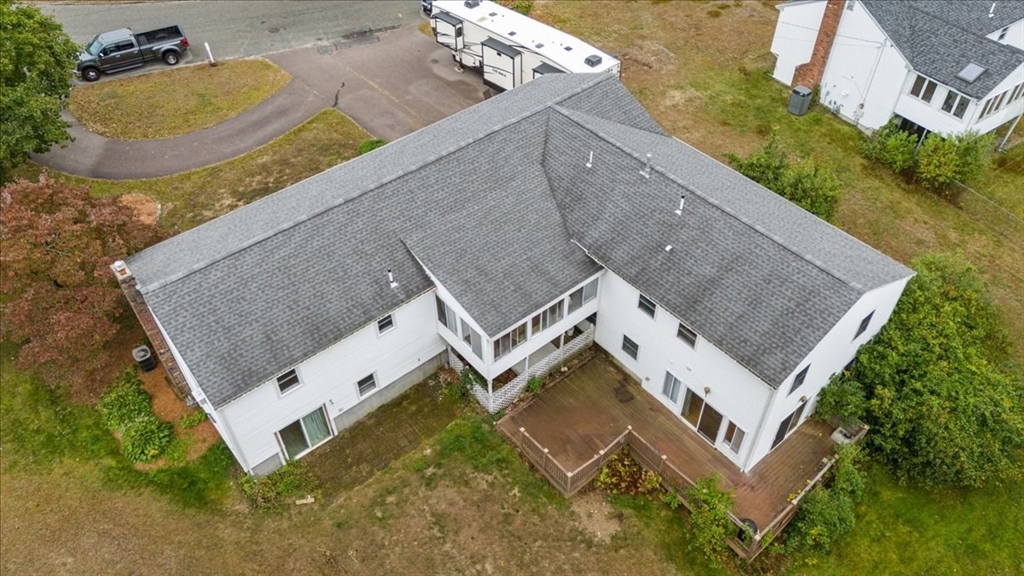 9 Georgia Drive Walpole, MA 02081 - Photo 2 of 42 an aerial view of a house with a swimming pool