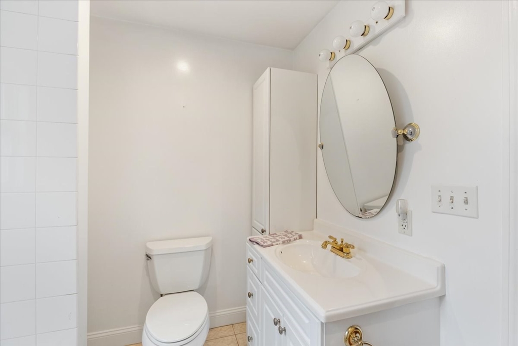 9 Georgia Drive Walpole, MA 02081 - Photo 22 of 42 a bathroom with a sink a toilet and mirror