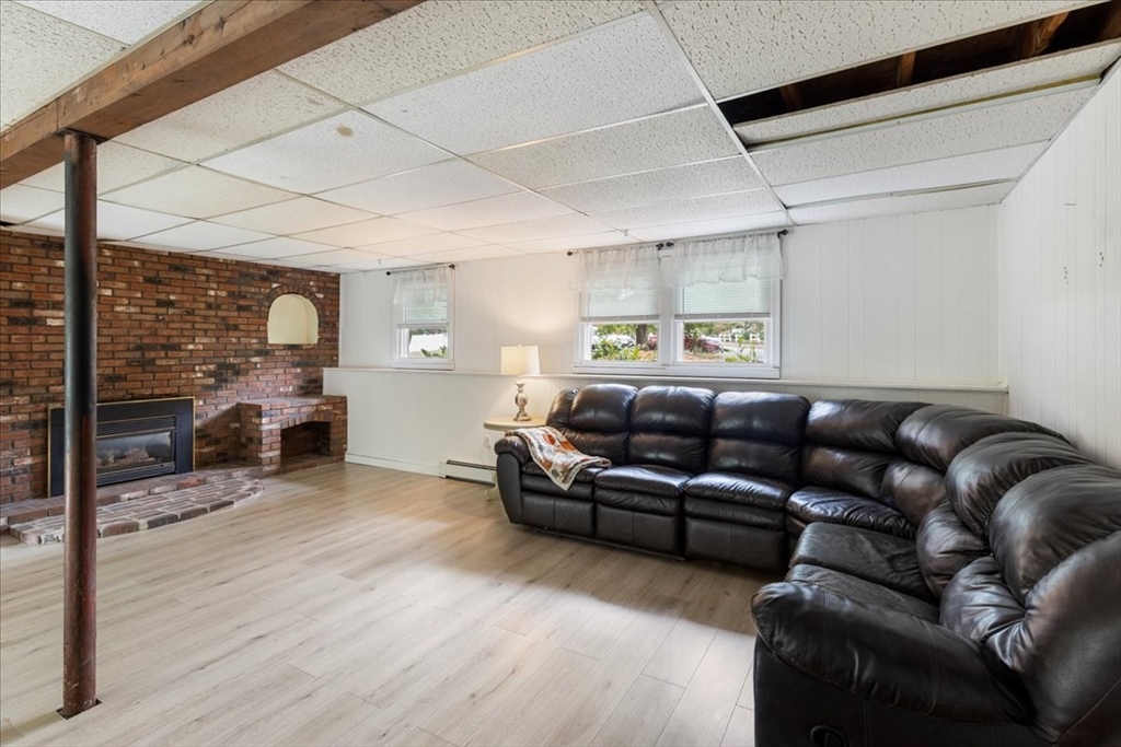 9 Georgia Drive Walpole, MA 02081 - Photo 24 of 42 a living room with furniture and a fireplace