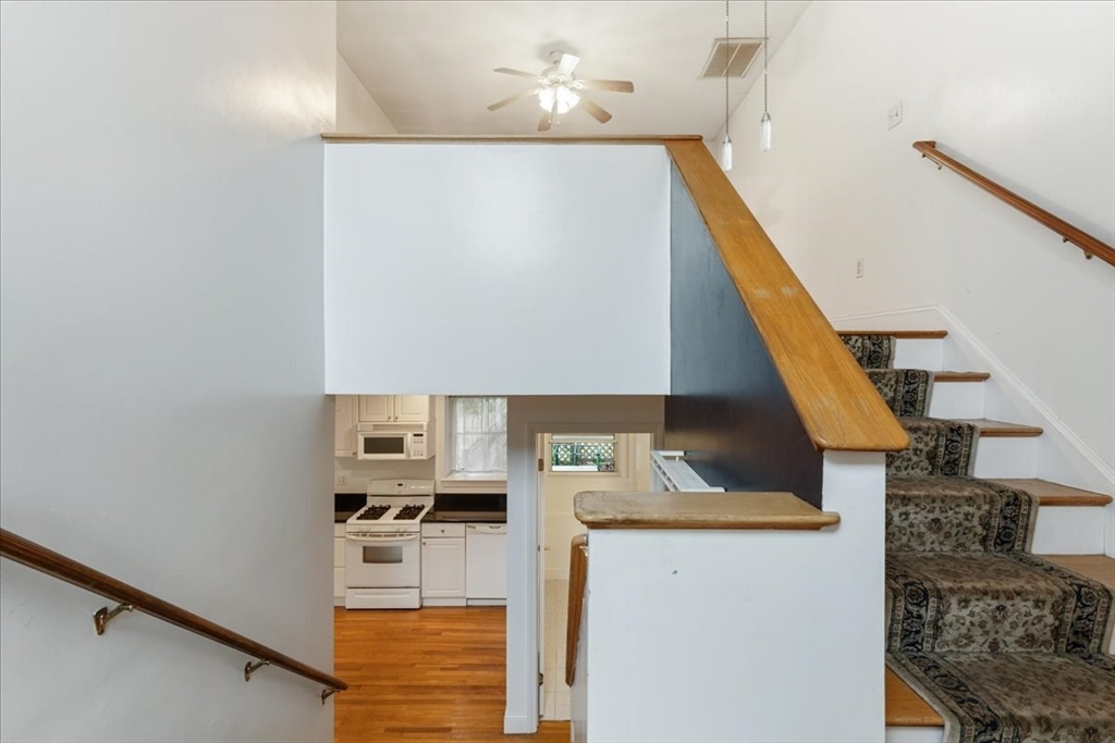 9 Georgia Drive Walpole, MA 02081 - Photo 29 of 42 a view of kitchen and utility room with stairs