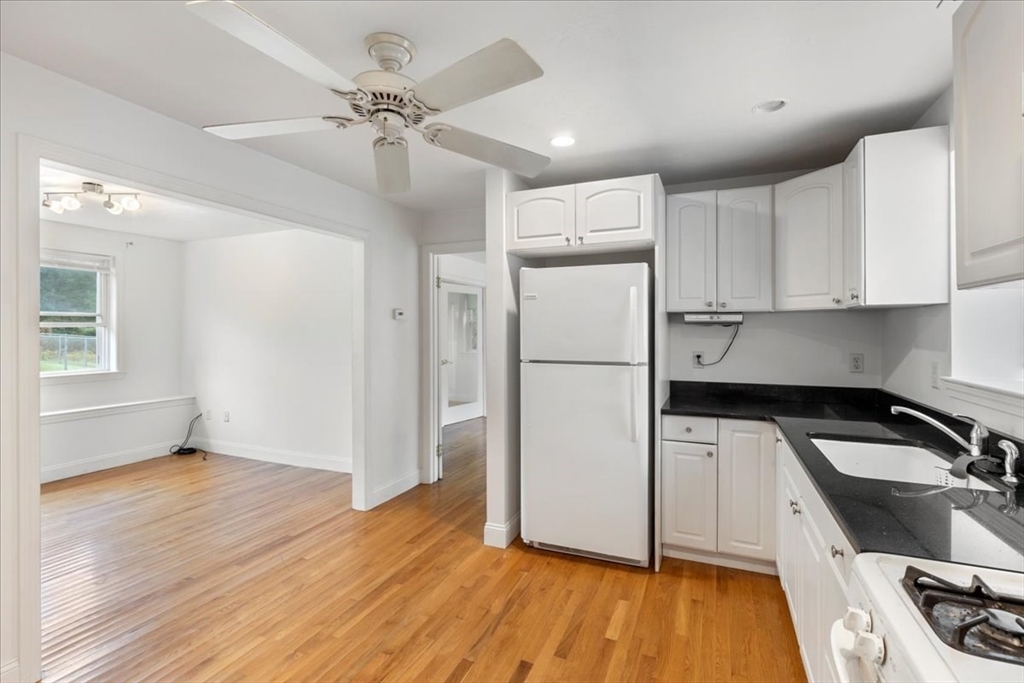 9 Georgia Drive Walpole, MA 02081 - Photo 31 of 42 a kitchen with granite countertop a refrigerator sink and cabinets