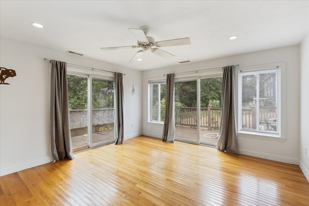 9 Georgia Drive Walpole, MA 02081 - Photo 33 of 42 a view of empty room with wooden floor and fan