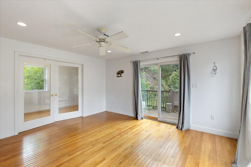 9 Georgia Drive Walpole, MA 02081 - Photo 34 of 42 a view of an empty room with wooden floor and a window