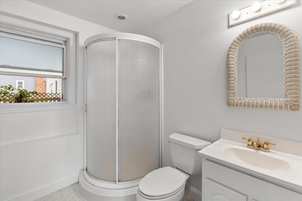 9 Georgia Drive Walpole, MA 02081 - Photo 38 of 42 a white toilet sitting next to a bathroom sink