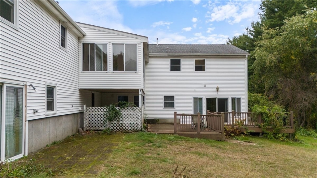 9 Georgia Drive Walpole, MA 02081 - Photo 4 of 42 a view of a house with a yard and furniture