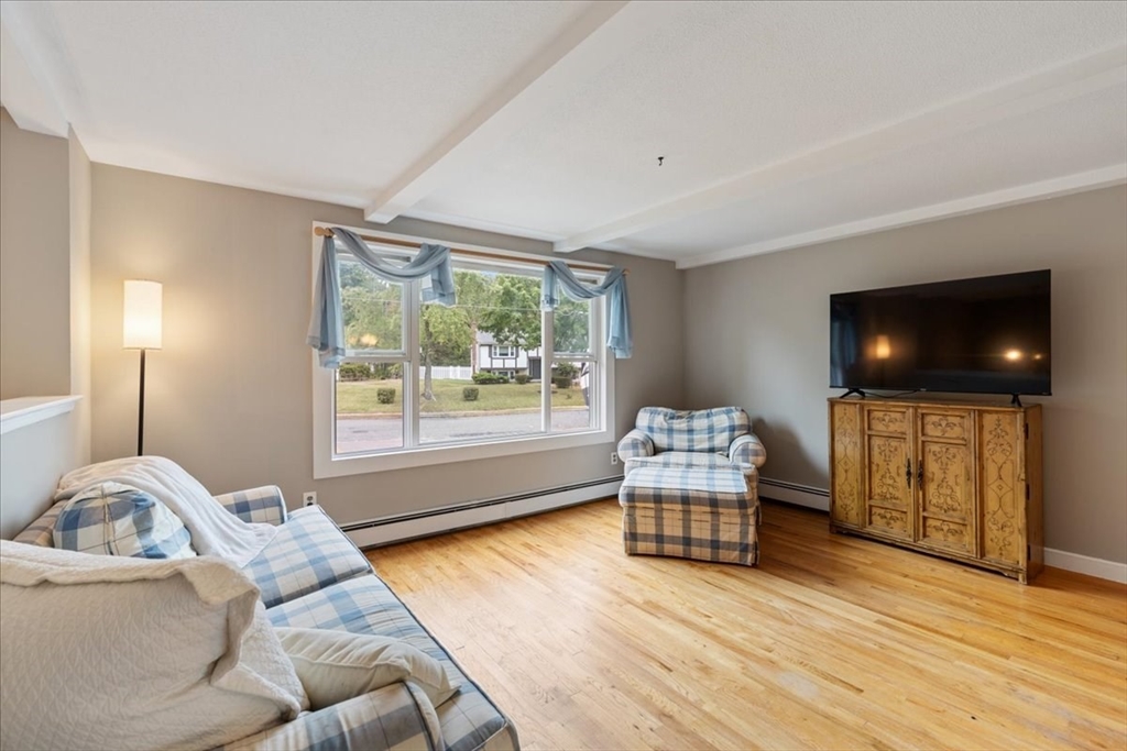 9 Georgia Drive Walpole, MA 02081 - Photo 5 of 42 a living room with furniture and a flat screen tv