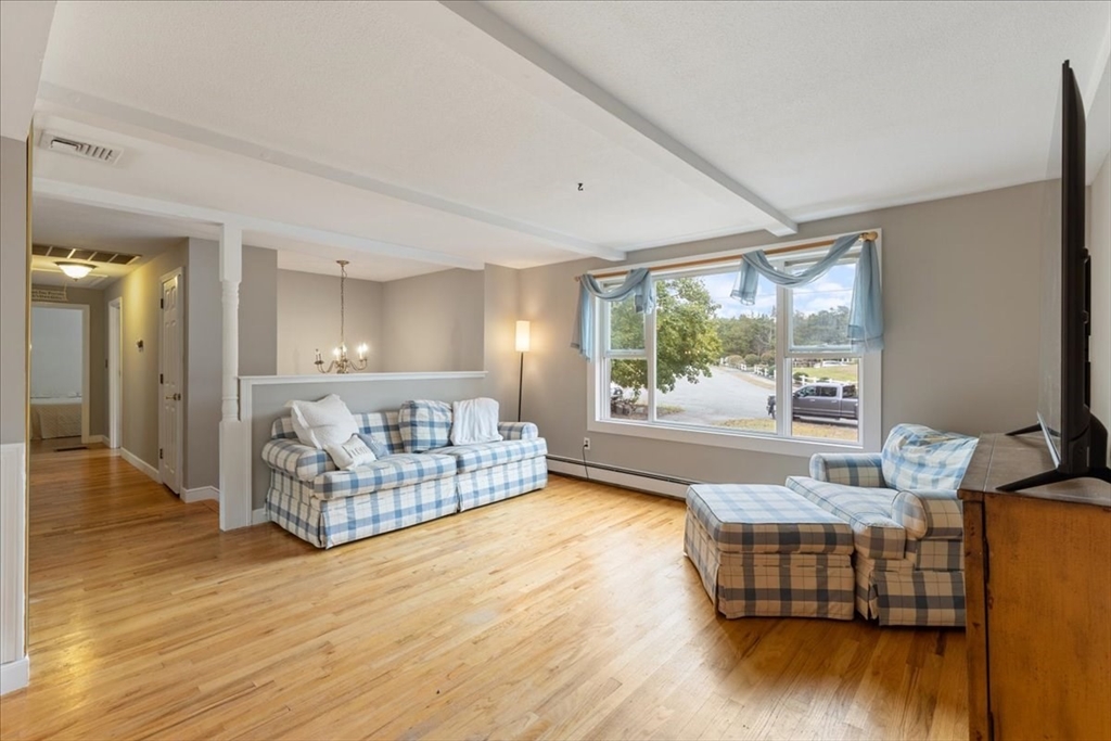 9 Georgia Drive Walpole, MA 02081 - Photo 6 of 42 a living room with furniture and a large window
