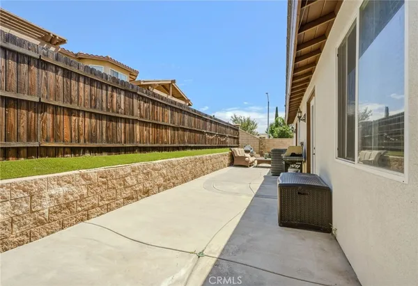 a view of a patio with wooden floor