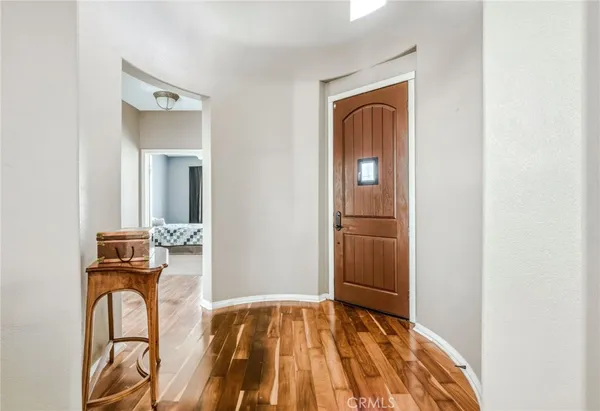 a view of an entryway with wooden floor