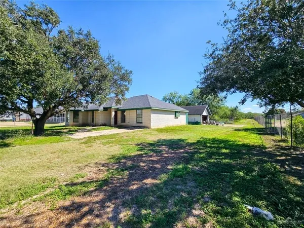 a view of a house with a big yard