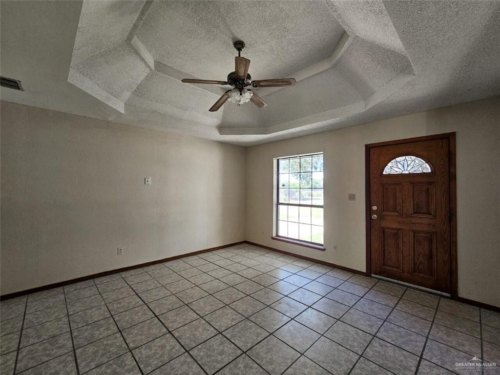 7706 North Jasman Road Edinburg, TX 78542 - Photo 3 of 15 an empty room with windows