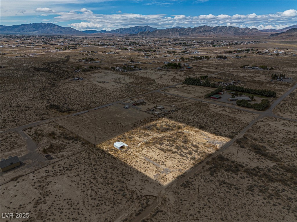 1411 West Harris Farm Road Pahrump, NV 89060 - Photo 2 of 25 Drone / aerial view with a mountain view and view of desert