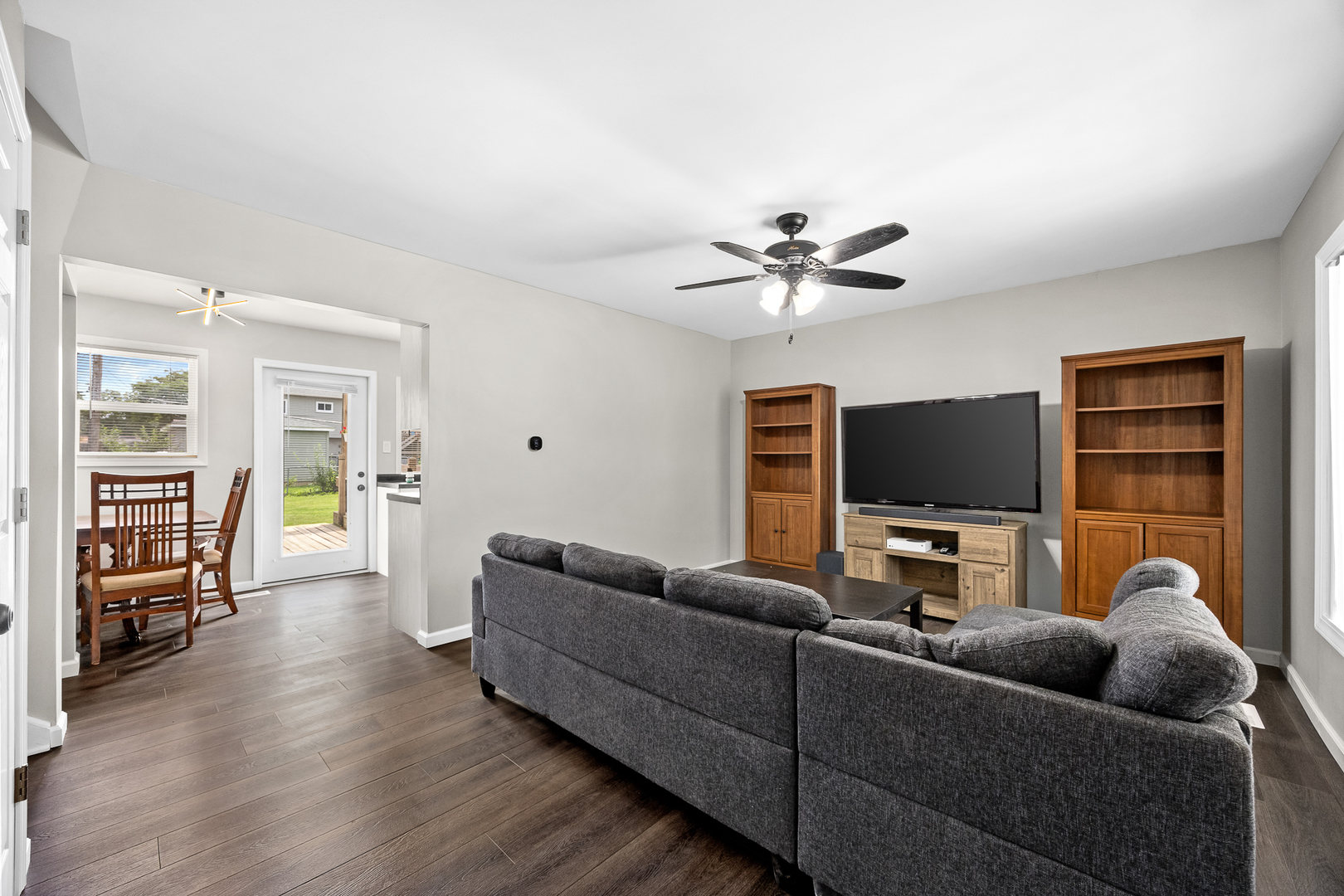 148 Bedford Road Bolingbrook, IL 60440 - Photo 8 of 32 a living room with furniture and a flat screen tv