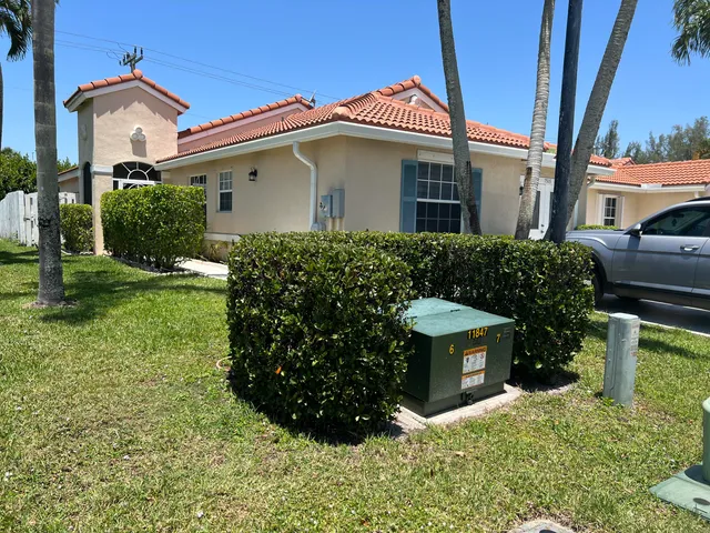 a view of a house with yard and a garden