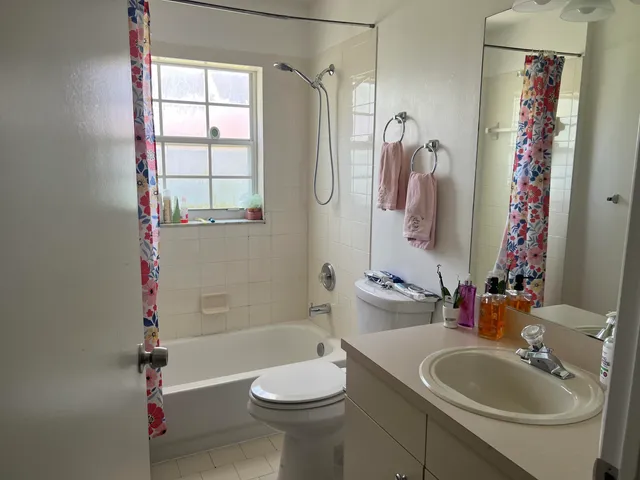 a bedroom with a bed and a desk